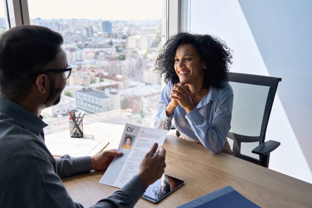 Man going over a resume with a woman