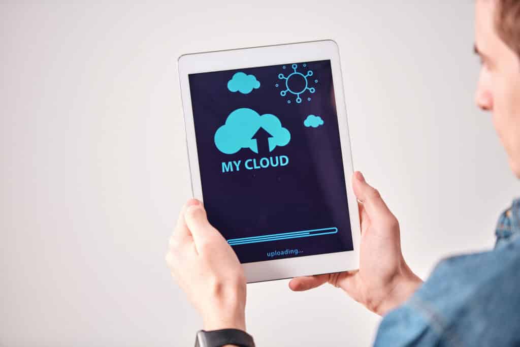 man using cloud services on an ipad