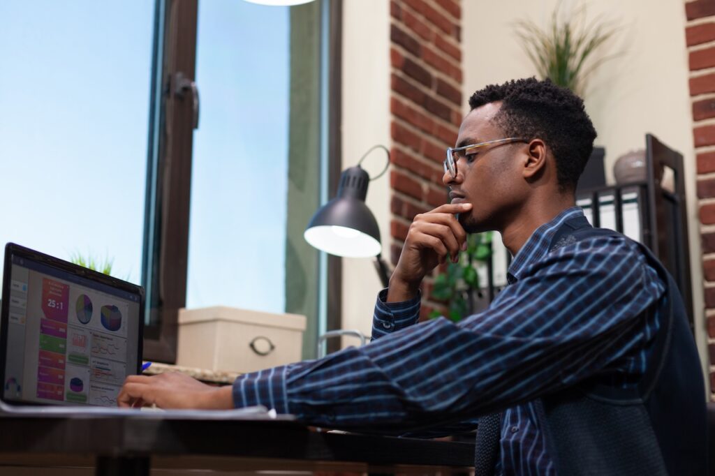 man working on computer using fort worth it solutions