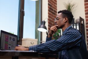 man working on computer using fort worth it solutions