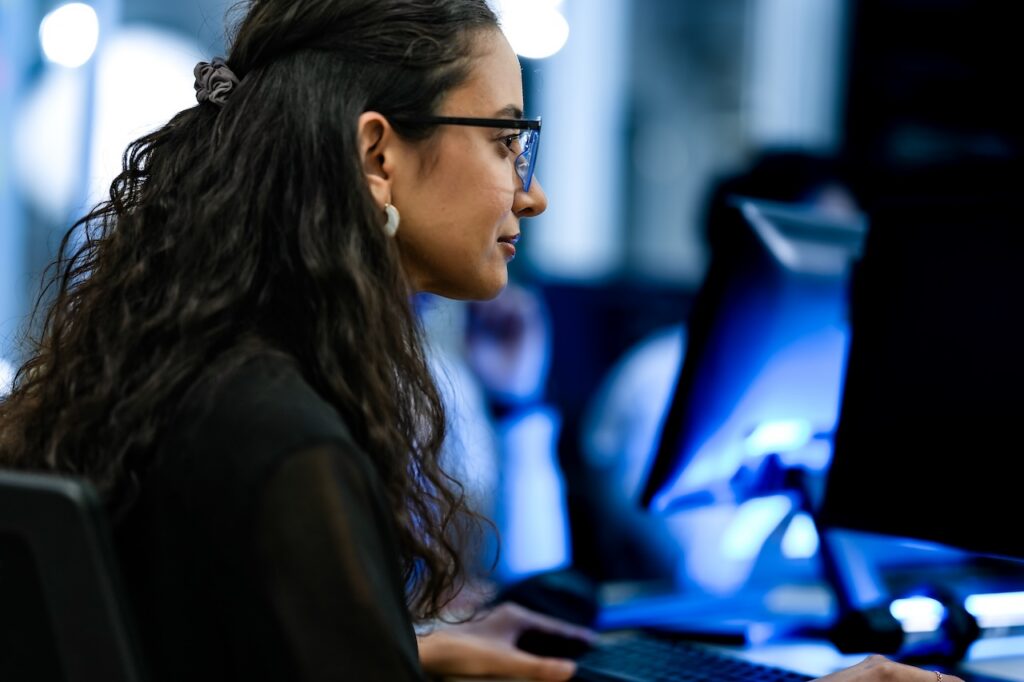 female employee working on computer in office